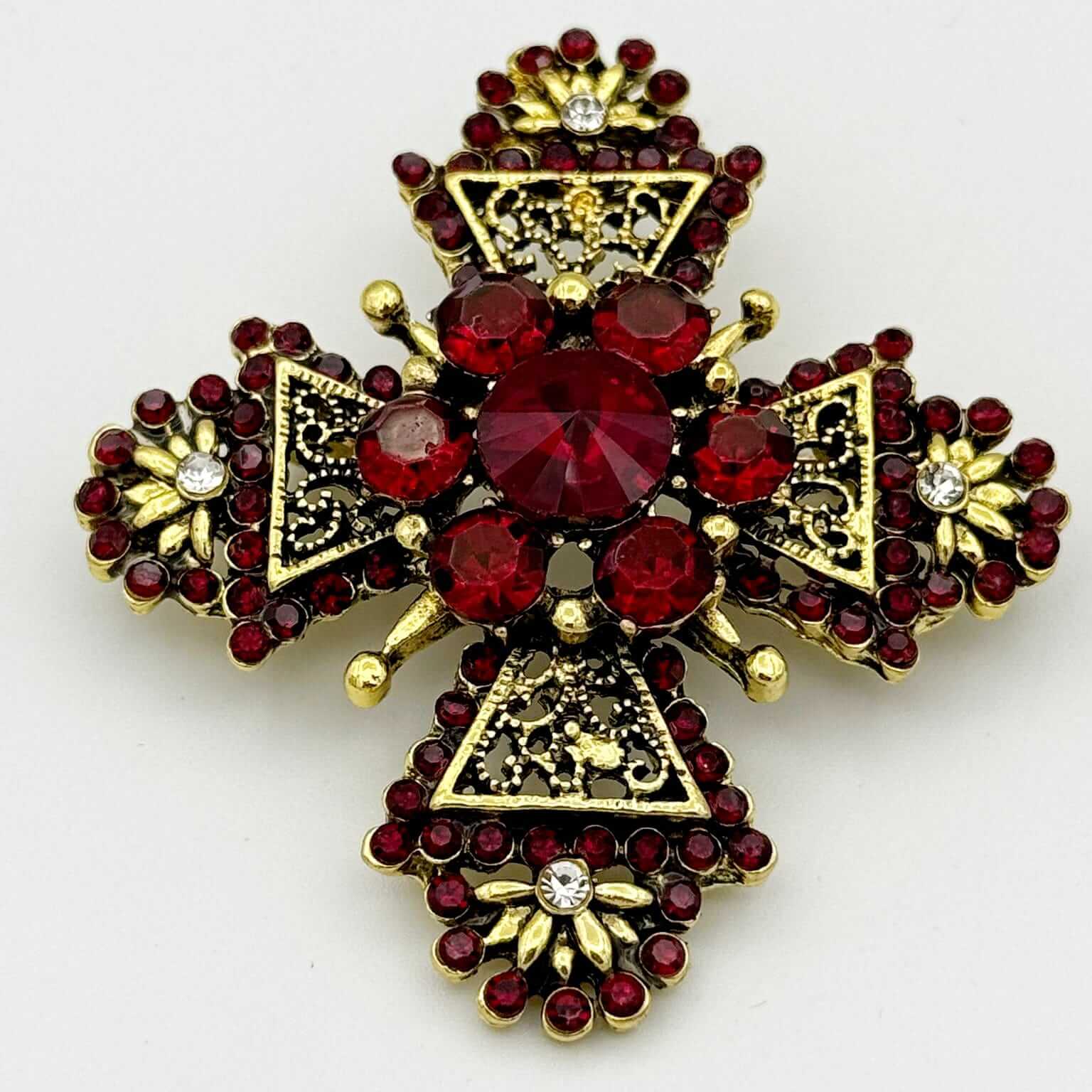 Ornate Gold Tone Crystal and Red Gemstone Cross Brooch